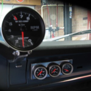 Dash cap, Monster tach & gauges in custom brackets.