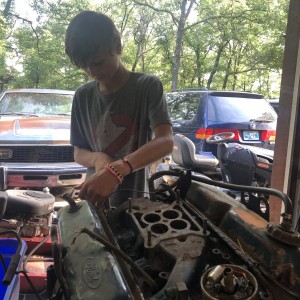 Josh turning a wrench